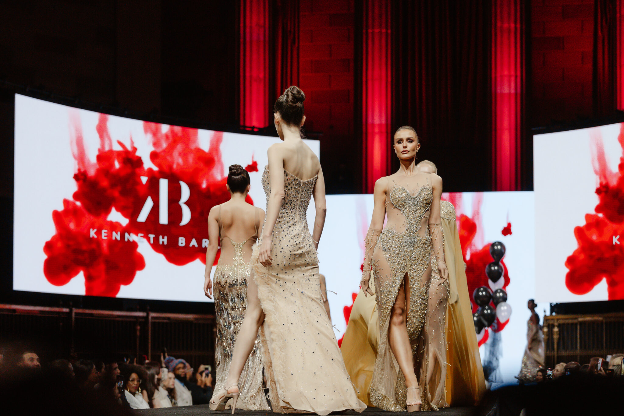 Models on the runway at The Bureau Fashion Week's New York Fashion Week show, with LED wall production and a full audience