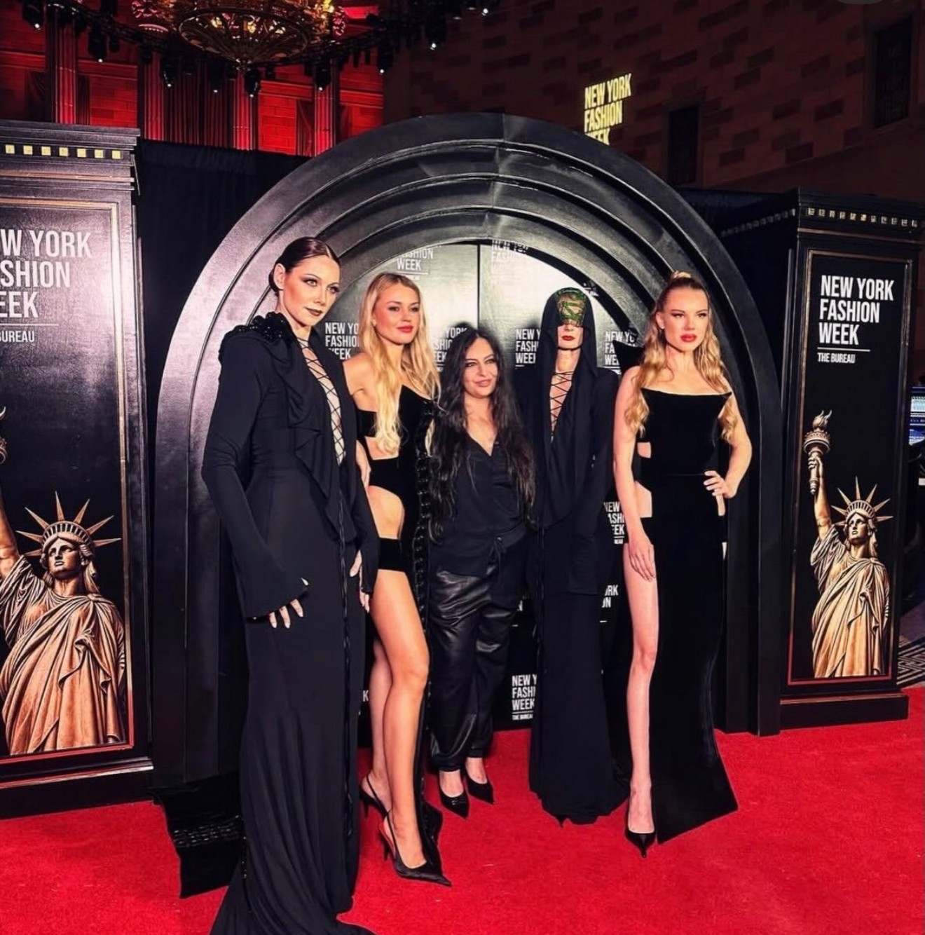 Content creators and guests on the New York Fashion Week red carpet at The Bureau's step-and-repeat arch