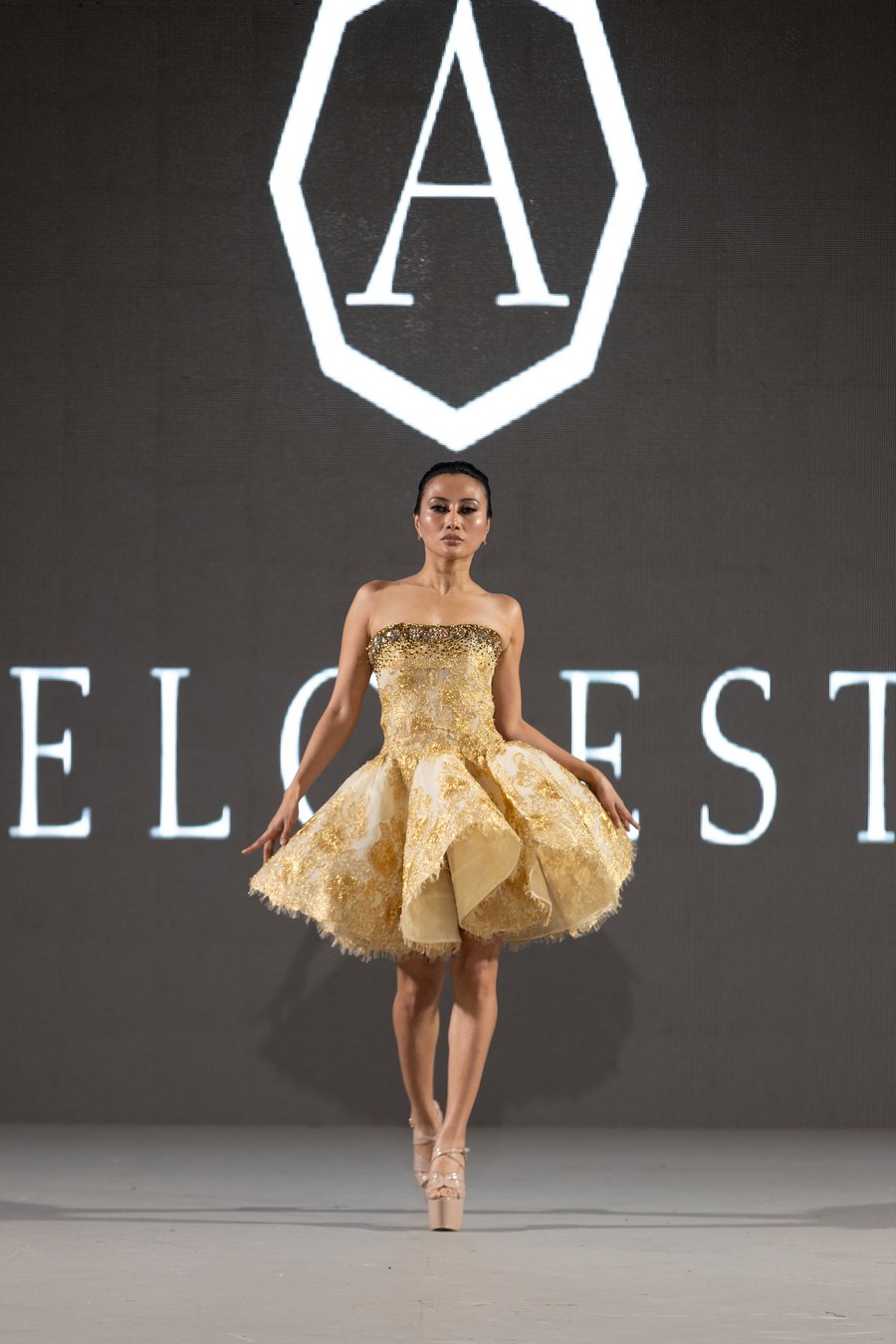 Gold couture gown on the runway