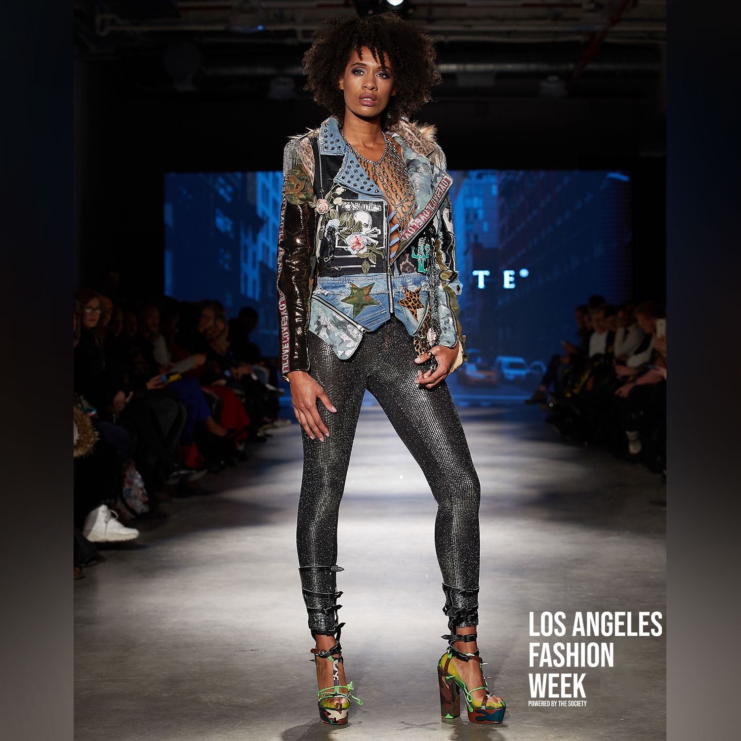 Model in an embellished statement jacket on the runway at Los Angeles Fashion Week